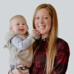Stephanie Vogler smiling and holding her daughter