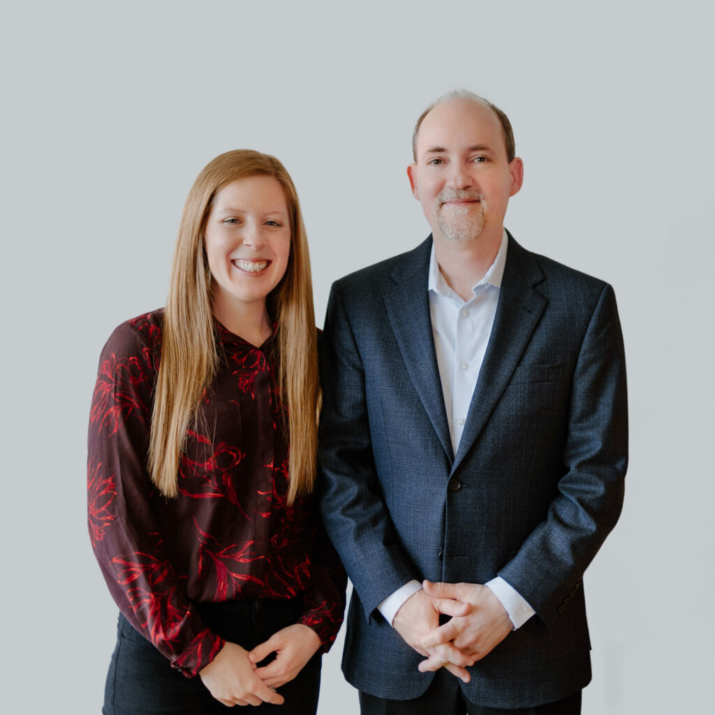 formal business photo of man and woman making up the leadership team
